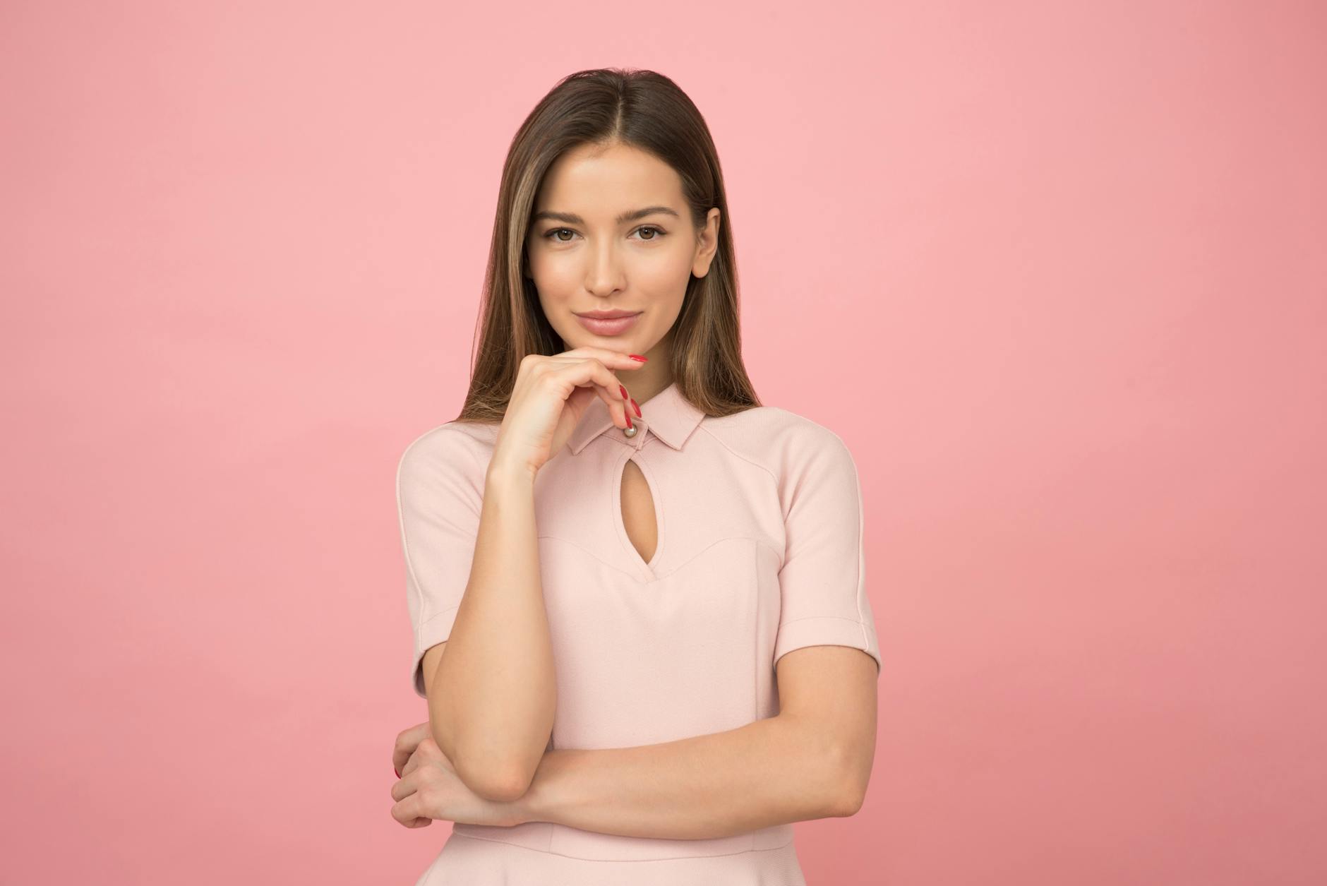 woman wearing pink collared half sleeved top